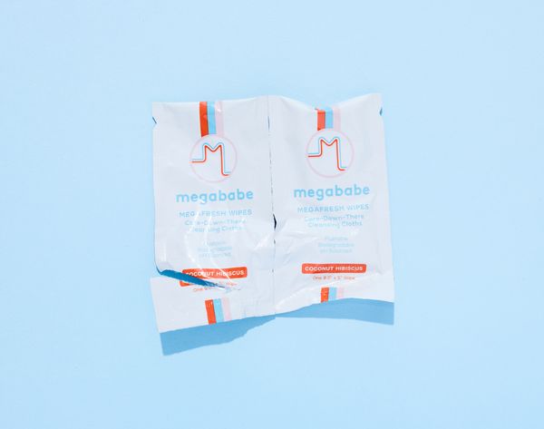 Freshly torn open package of Megababe Megafresh Wipes