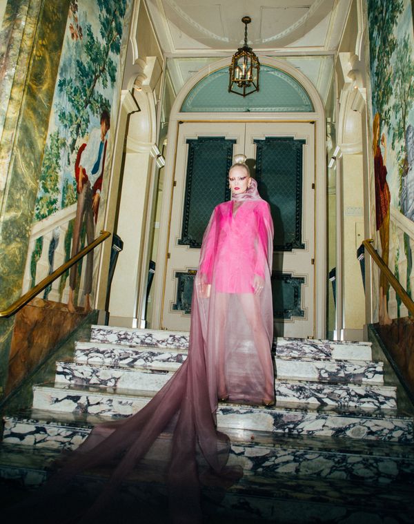 Pom Klementieff posed on a staircase in a hot pink gown for the 2019 Met Gala