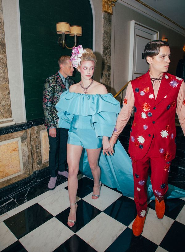 Lili Reinhart and Cole Sprouse holding hands and dressed in camp-themed attire for the 2019 Met Gala